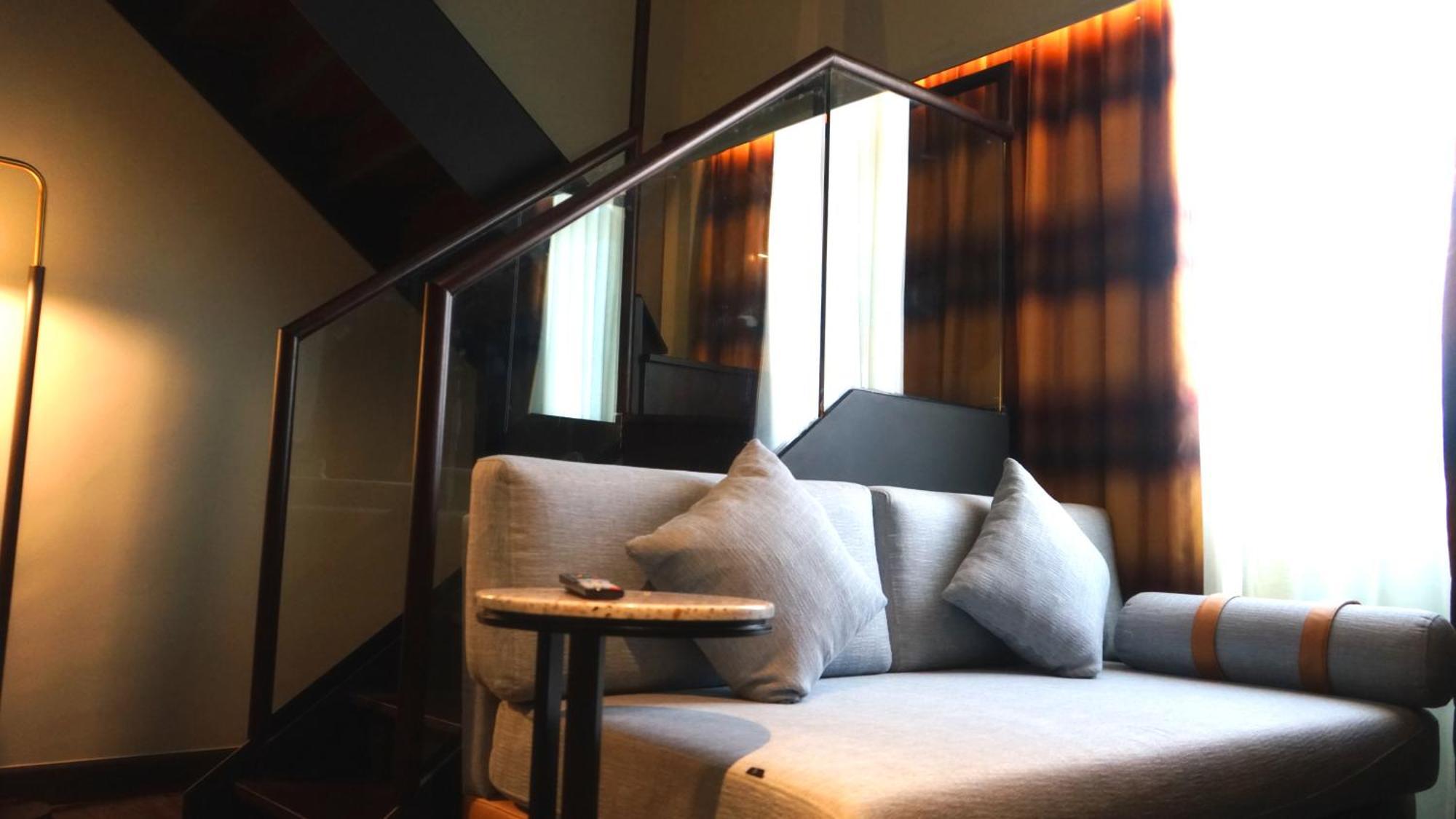 The George Penang By The Crest Collection Hotel George Town Exterior photo A sofa in a hotel room