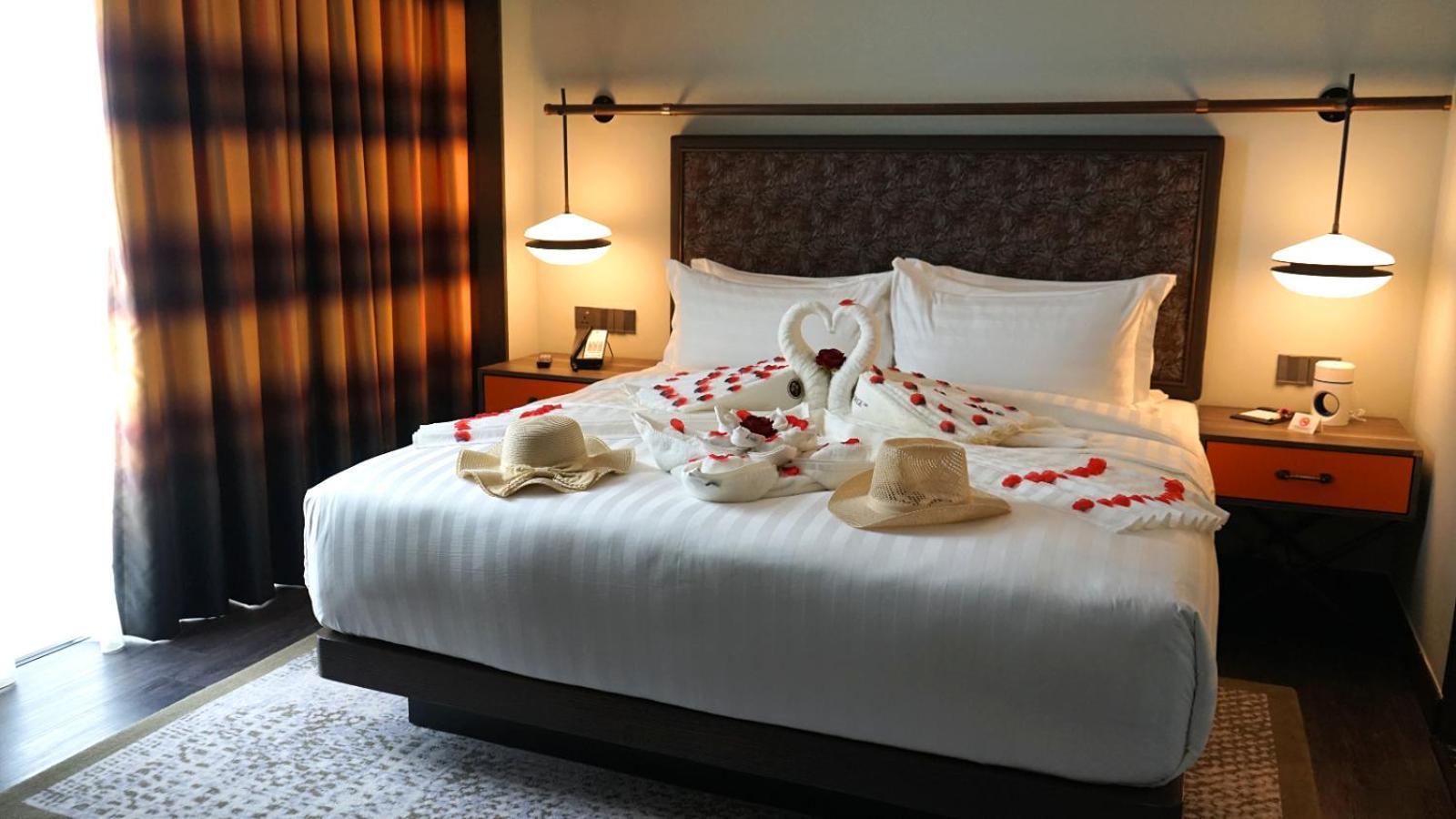 The George Penang By The Crest Collection Hotel George Town Exterior photo A bed with a swan shaped towel
